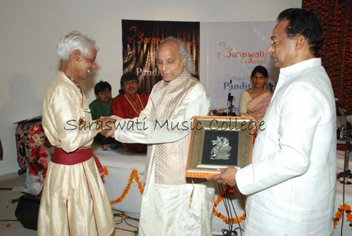 A felicitation ceremony on stage